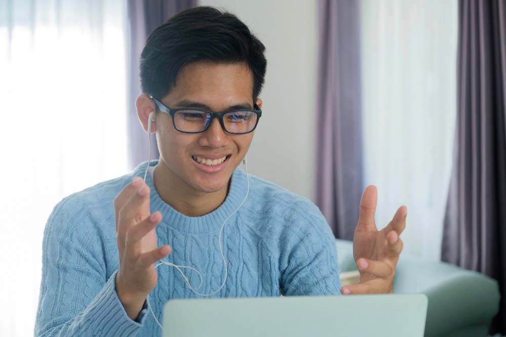 logo-design Smiling person talking on a video call